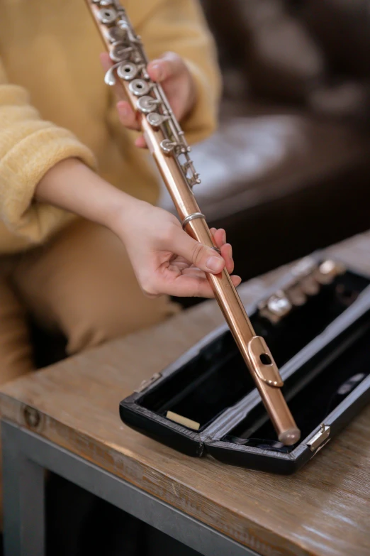 a close up of a person holding a flute, rose gold, quick assembly, thumbnail, rectangular