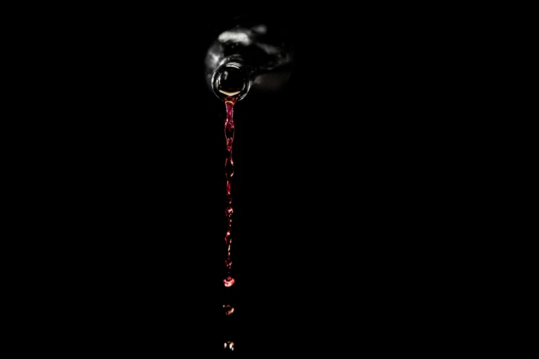 a close up of a liquid dripping from a faucet, an album cover, deviantart, red wine, [ horror game ], mobile wallpaper, background ( dark _ smokiness )