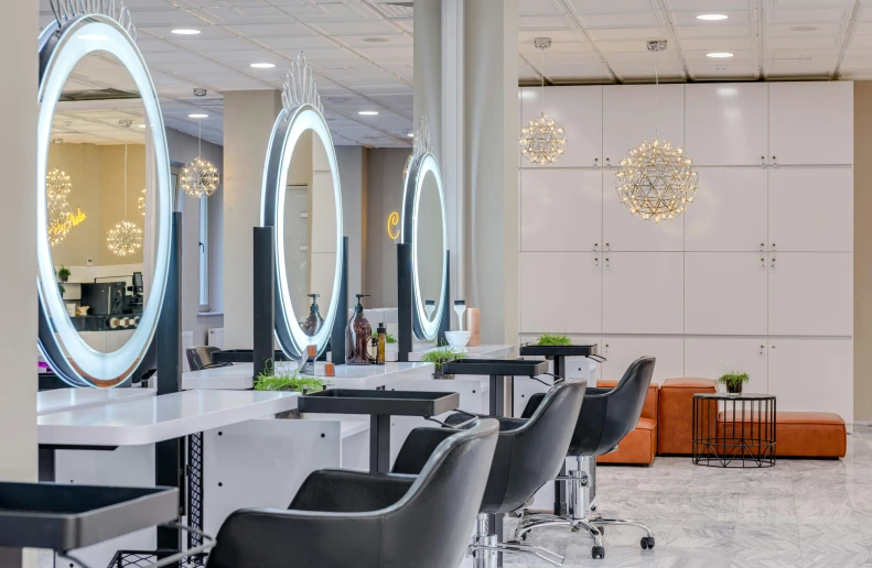 a salon with a lot of chairs and mirrors, electrified hair, profile image, fan favorite, bright lighting