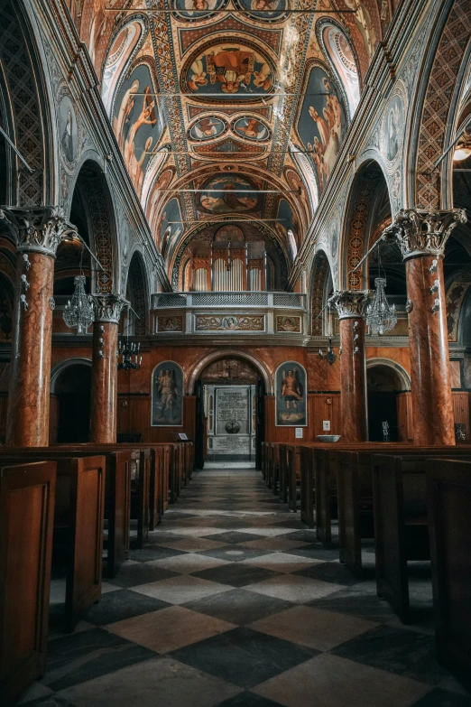 a church filled with lots of wooden pews, pexels contest winner, baroque, marbled columns, distant photo, black and terracotta, mediterranean