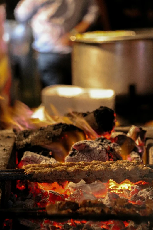 a close up of food cooking on a grill, cosy fireplace, food stalls, beautifully soft lit, multicoloured