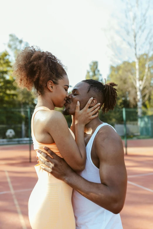 a man and woman kissing on a tennis court, pexels contest winner, wearing a tank top and shorts, ashteroth, arian mark, square