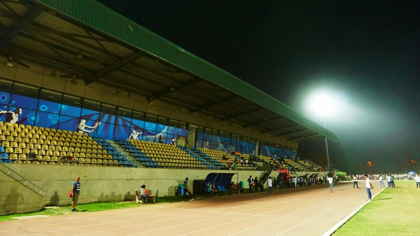 a group of people standing on top of a track, in the evening, football, pavilion, profile image