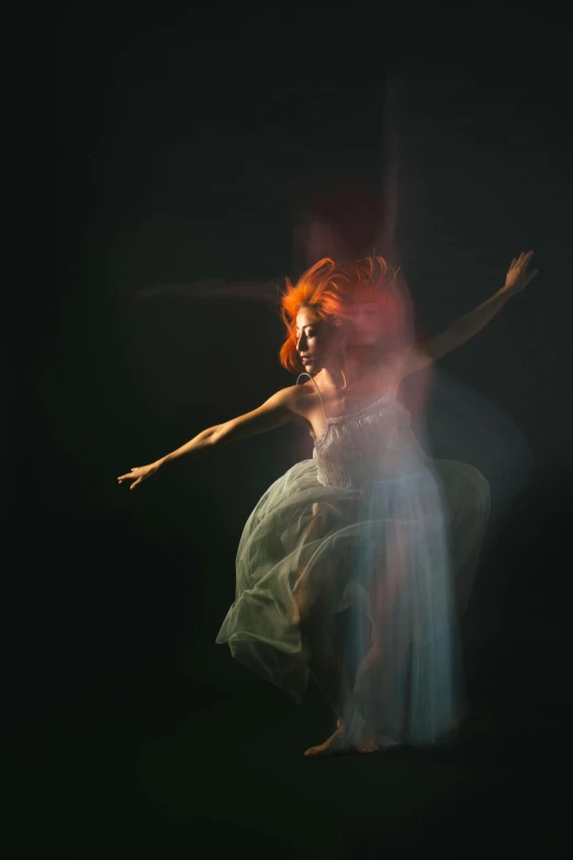 a woman in a green dress under water, by Elizabeth Polunin, pexels contest winner, art photography, red glowing hair, floating in mist, dark. studio lighting, hologram hovering around her