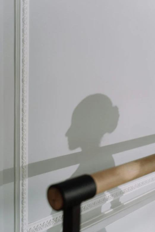 a shadow of a person holding a baseball bat, inspired by Clarice Beckett, white walls, ignant, face obscured, reflective surface