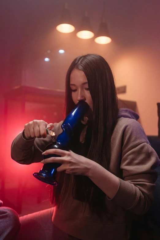 a woman blow drying her hair with a blow dryer, by Julia Pishtar, featured on reddit, fine art, ganja, from a huge red glass bong, blue smoke, tournament