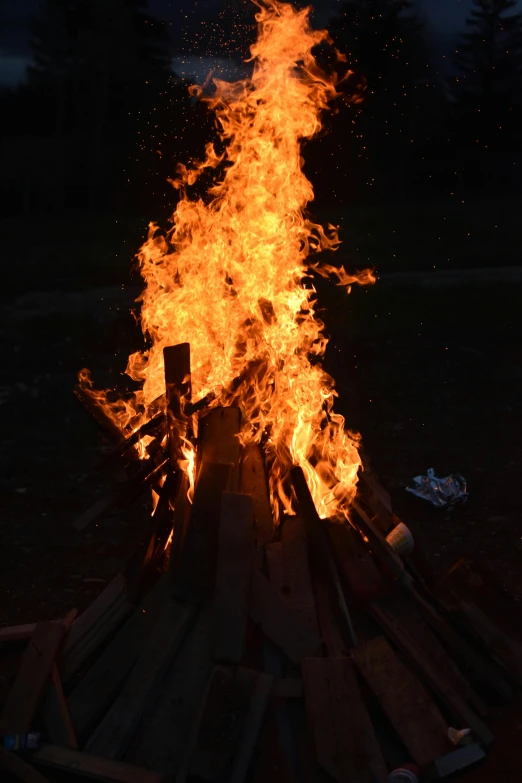 a bonfire in the middle of a field at night, slide show, menacing!, frontal shot, profile image