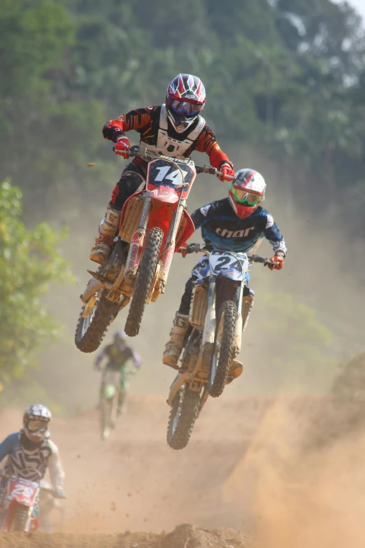 a man flying through the air while riding a dirt bike, riding a motorbike, race, brown