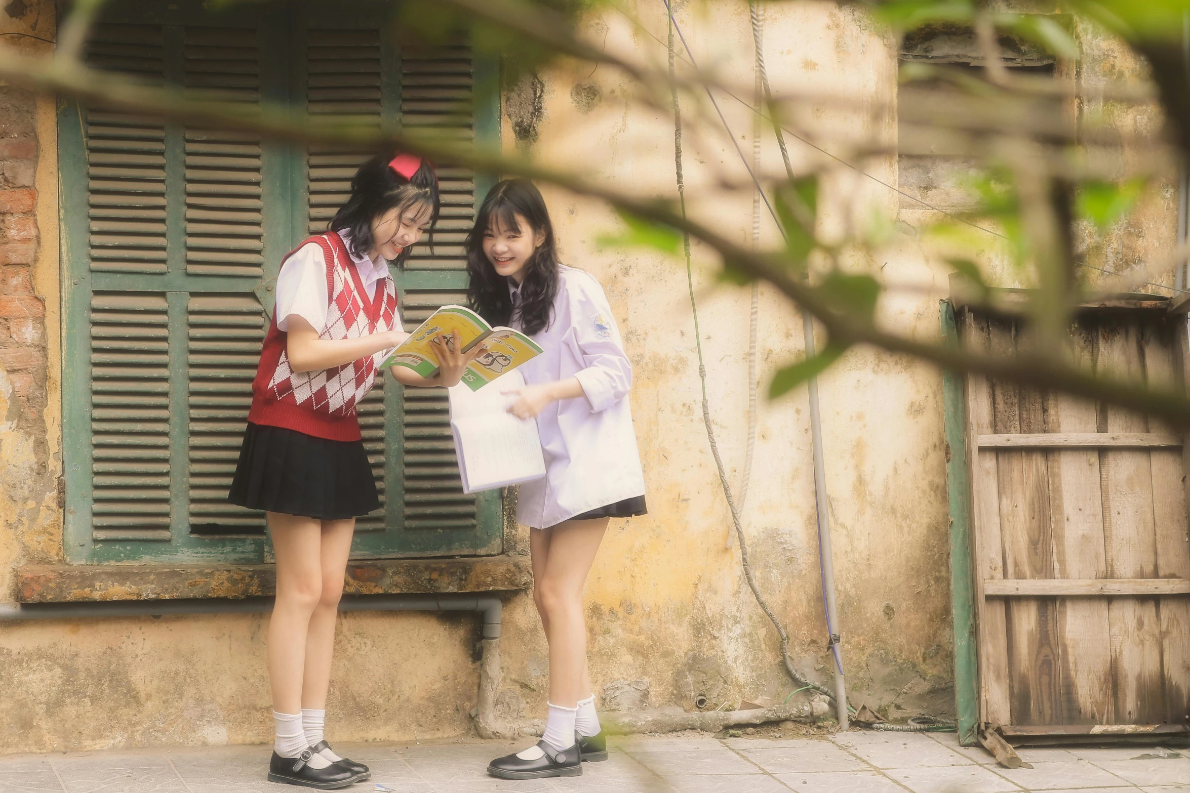 a couple of girls standing next to each other, a picture, by Wen Zhenheng, pexels contest winner, academic art, seifuku, mai anh tran, reading, ( ( theatrical ) )