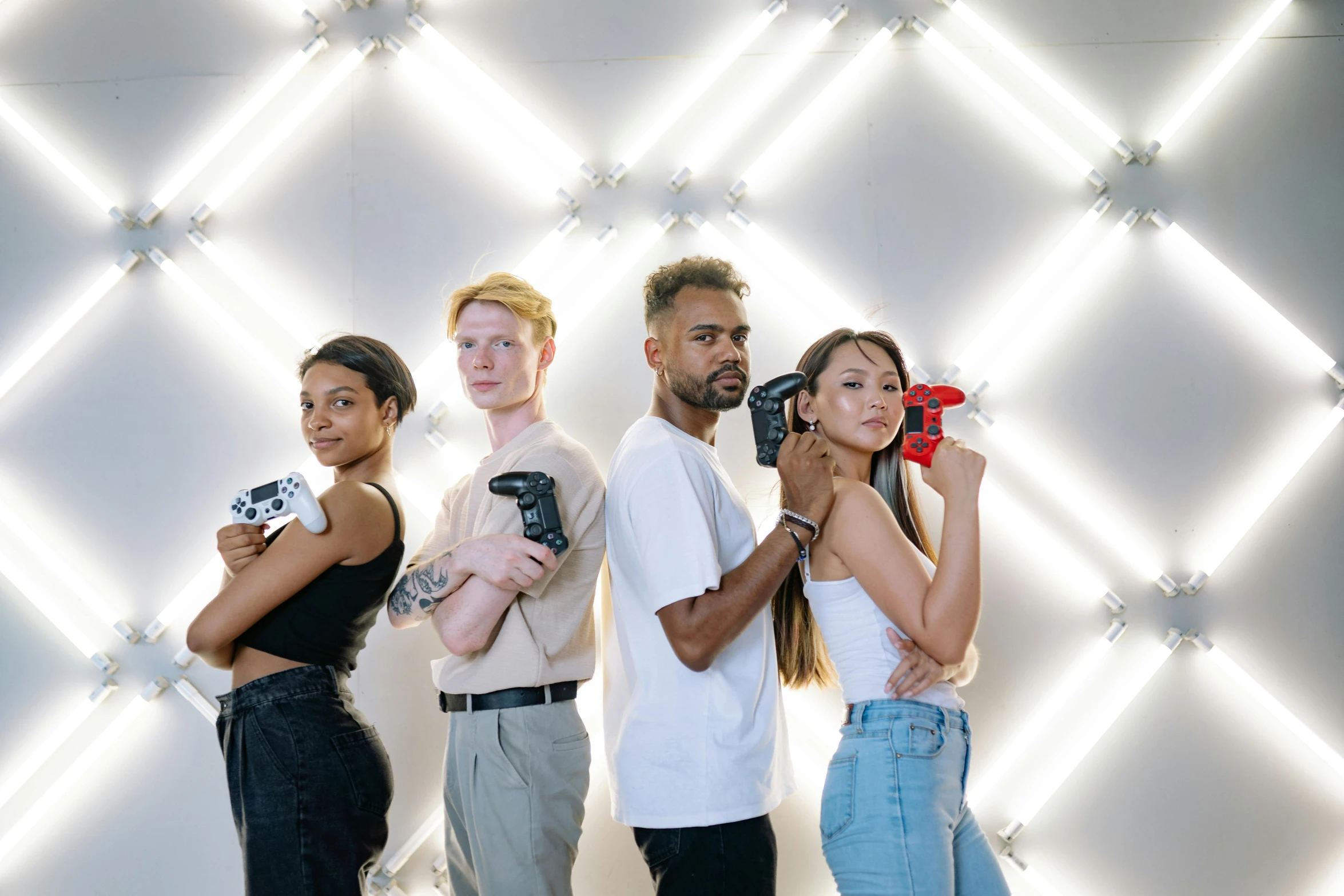 a group of people standing next to each other, holding controller, profile image, photoshoot for skincare brand, laser guns