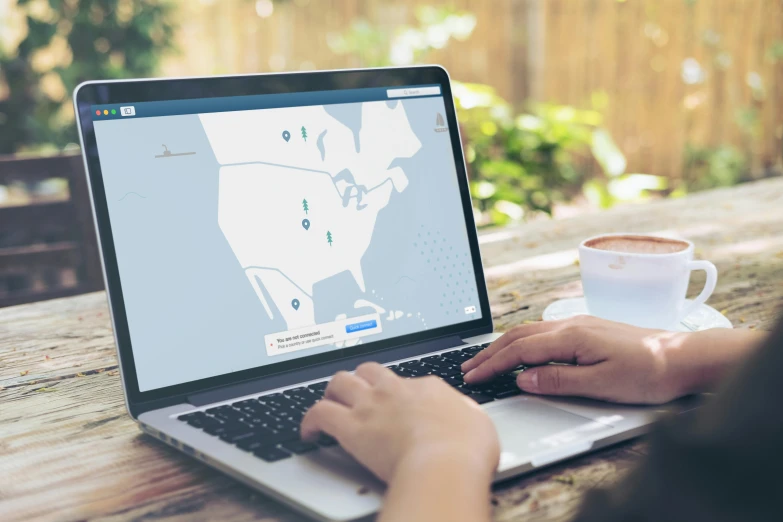 a person using a laptop on a wooden table, a digital rendering, by Sebastian Vrancx, trending on unsplash, steam workshop maps, navy, 2 5 6 x 2 5 6 pixels, cover shot