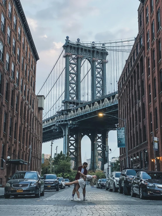a woman standing in the middle of a street in front of a bridge, new york buildings, 🚿🗝📝, 4k image”
