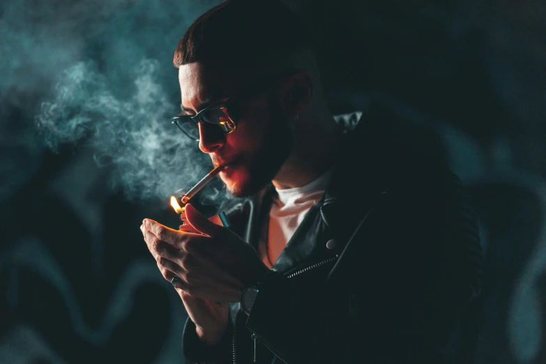 a man in a leather jacket smoking a cigarette, inspired by Elsa Bleda, pexels contest winner, gendo ikari smoking a joint, mac miller, dark shades, late night