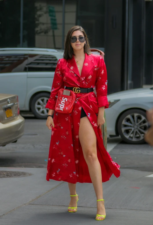 a woman in a red dress is walking down the street, charli xcx, humans of new york style, 15081959 21121991 01012000 4k, kimono