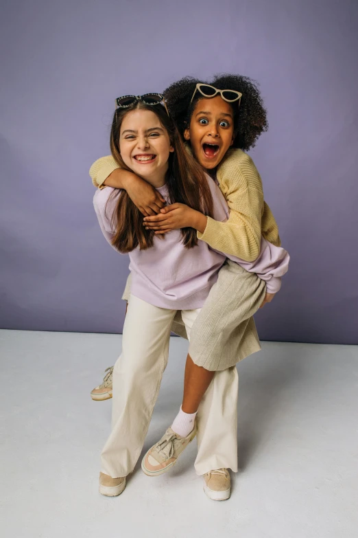 a couple of girls standing next to each other, promo image, kids playing, ((purple)), taupe