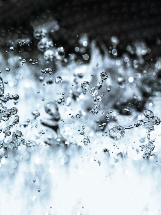 a close up of a fire hydrant with water coming out of it, unsplash, underwater bubbles background, background image, thumbnail, window ( rain )