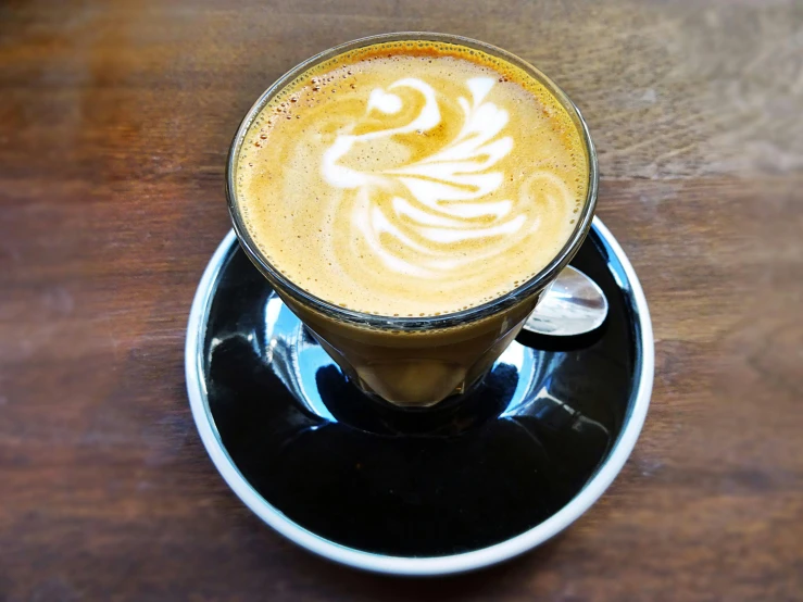 a close up of a cup of coffee on a saucer, caulfield, instagram photo, an enormous, te pae