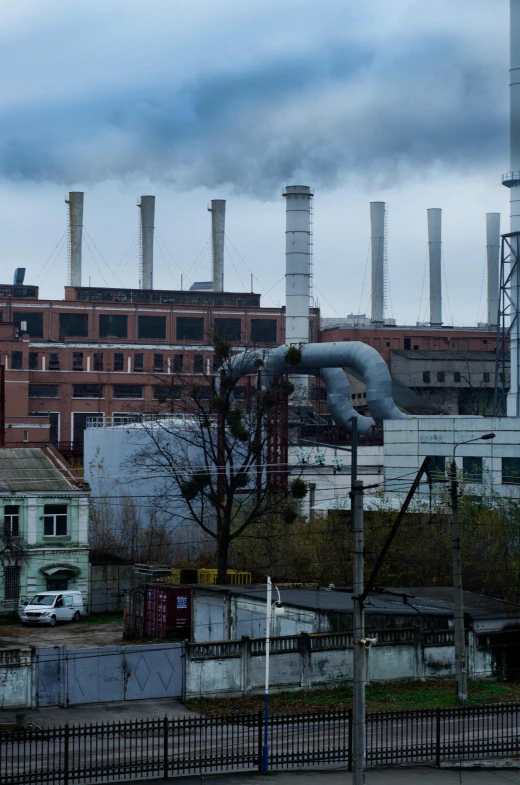 a factory with a lot of smoke coming out of it, by Ludwik Konarzewski, pexels contest winner, socialist realism, 15081959 21121991 01012000 4k, gloomy skies, typical russian atmosphere, neo norilsk