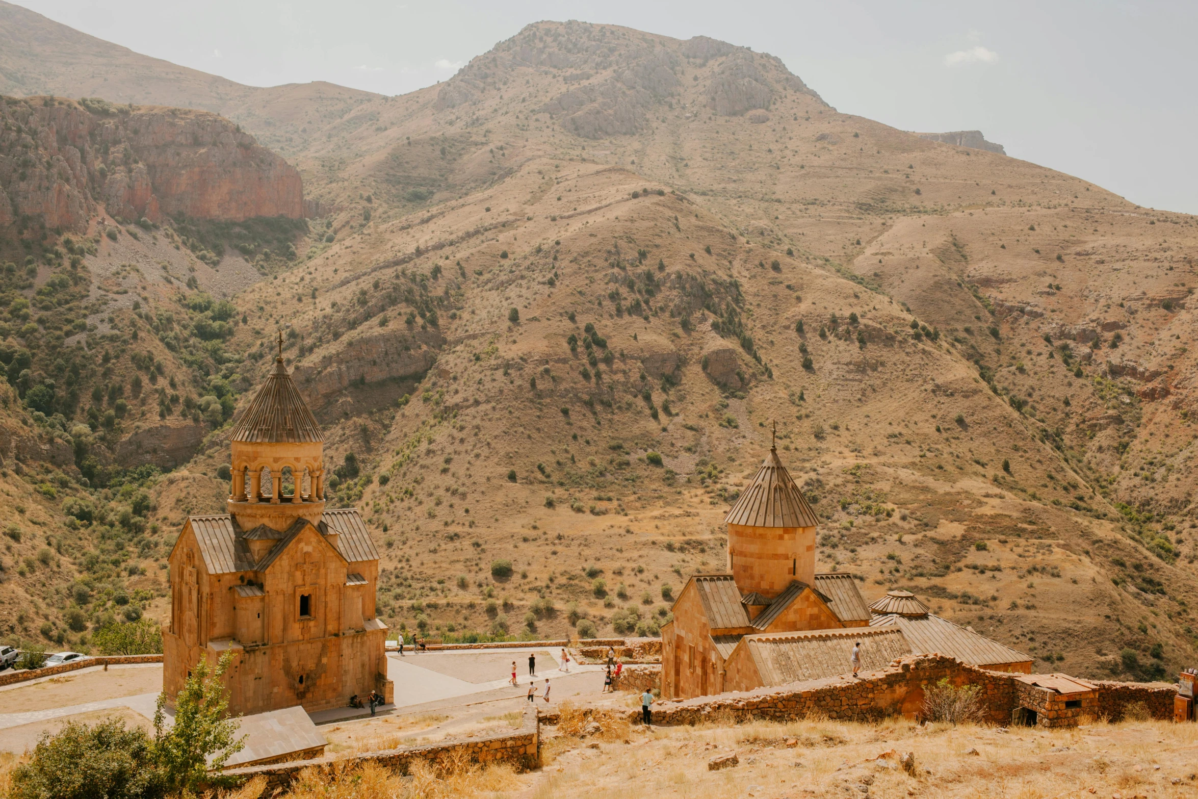 a church in the middle of a desert with mountains in the background, pexels contest winner, les nabis, georgic, overlooking a valley with trees, assyrian, background image