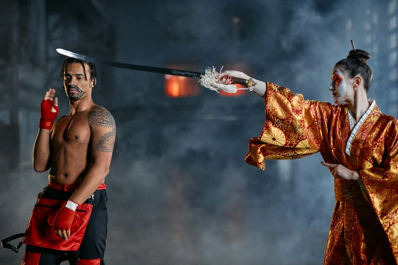 a couple of men standing next to each other, inspired by Ma Quan, pexels contest winner, arabesque, fire punch, 3 actors on stage, kickboxing, holding a torch