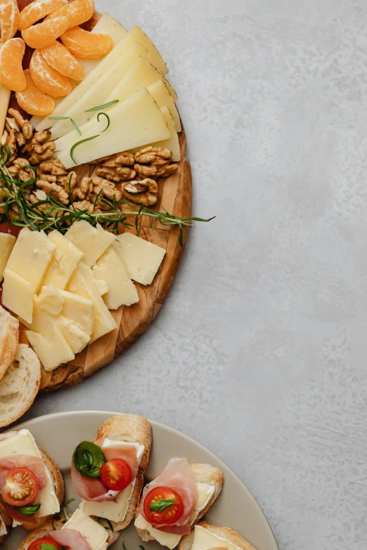 a close up of a plate of food on a table, inspired by david rubín, shutterstock contest winner, renaissance, cheeses, asset on grey background, breads, banner