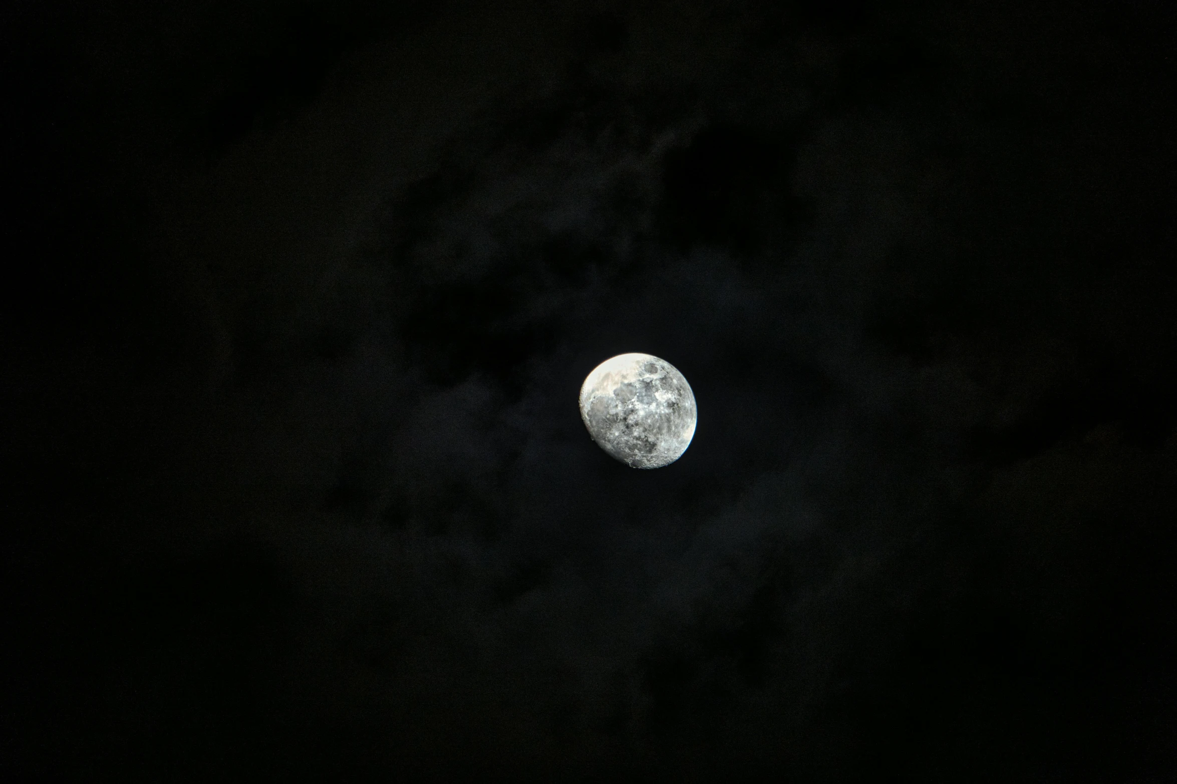 a full moon is seen through the clouds, an album cover, pexels, minimalism, shot on sony a 7 iii, ☁🌪🌙👩🏾, in outer space, moonlight grey