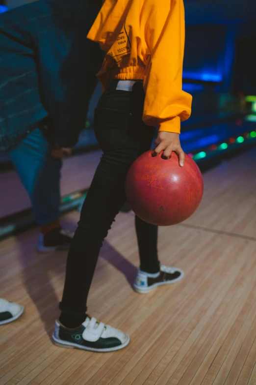 a woman holding a bowling ball in a bowling alley, 💣 💥💣 💥, head down, ballard, profile image