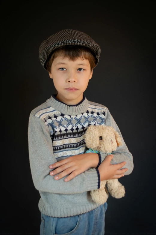 a little boy that is holding a teddy bear, a colorized photo, inspired by George Barker, pexels contest winner, visual art, berets, wearing casual sweater, frown fashion model, with professional lighting