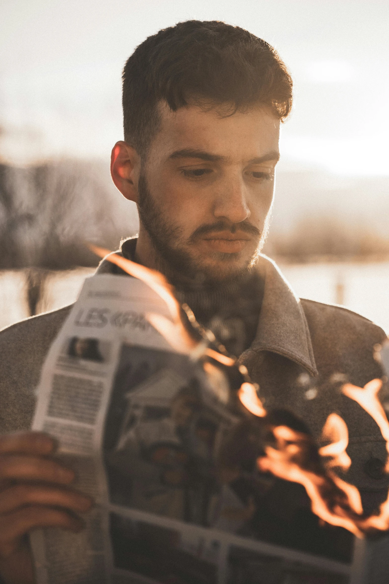 a man reading a newspaper next to a lake, a picture, pexels contest winner, flaming hair, light stubble beard, handsome girl, avatar image