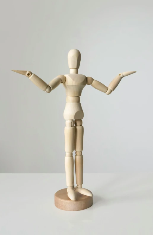 a wooden mannequin standing on a white surface, unsplash, fully posable, arms open, pose 4 of 1 6, annoyed