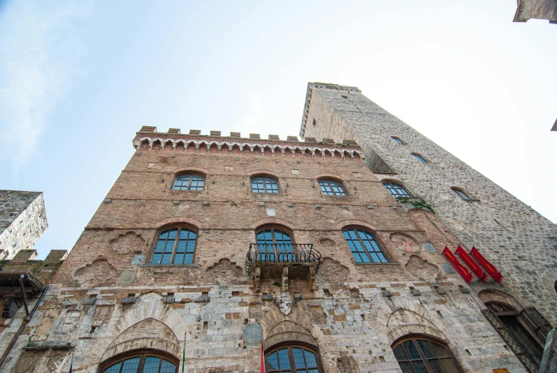 a tall brick building with lots of windows, inspired by Francesco del Cossa, renaissance, palace floating in the sky, ancient silver tower of the moon, bargello, promo image