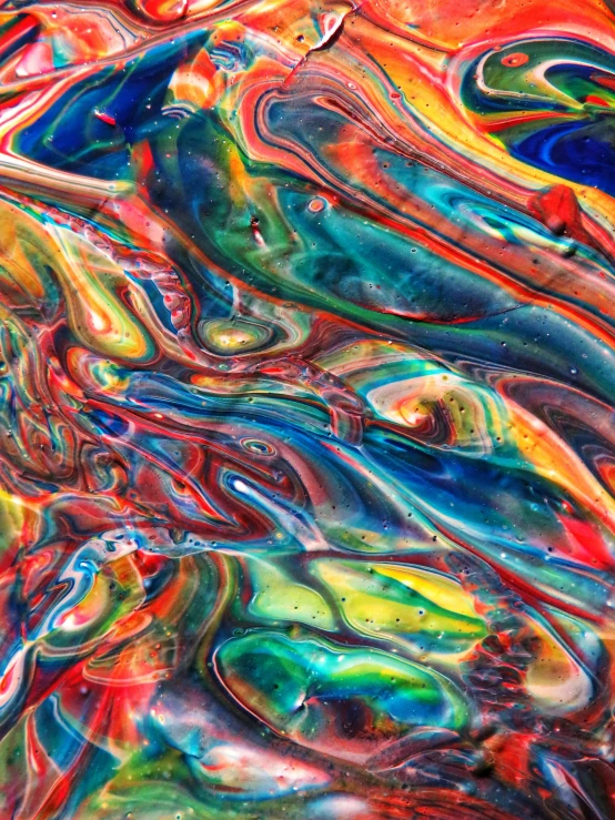 a close up of a colorful painting on a table, inspired by Umberto Boccioni, trending on pexels, colourful slime, multicolor, marbled, color image