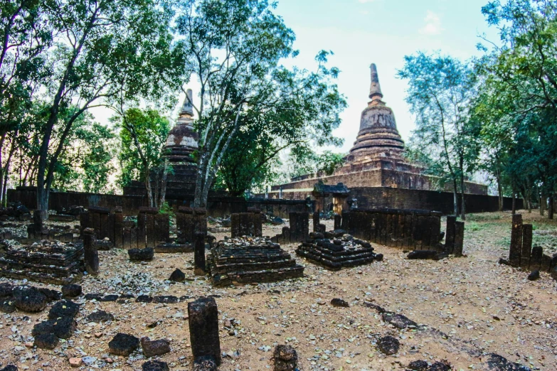 a group of ruins sitting on top of a dirt field, thawan duchanee, shrines, fan favorite, gravels around