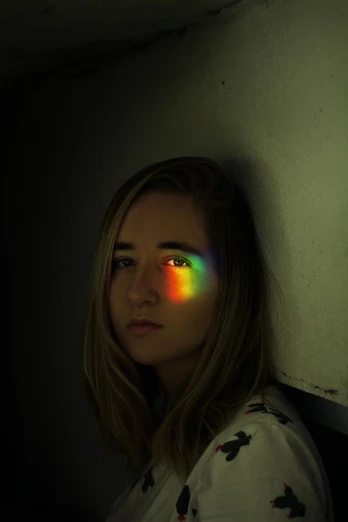 a woman with a rainbow light on her face, inspired by Gabriel Dawe, unsplash contest winner, holography, saoirse ronan, medium shot portrait, low quality photo, !!! colored photography