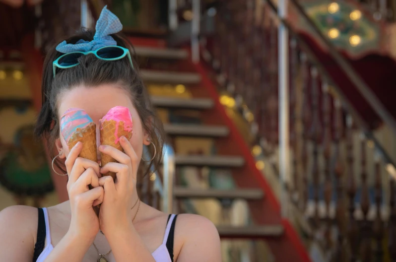 a girl holding a donut in front of her face, by Alice Mason, pexels contest winner, ice cream cones, vacation photo, pink and blue colour, wheres wally