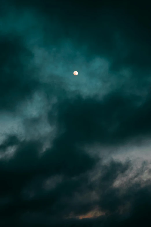 the moon is shining through the dark clouds, inspired by Elsa Bleda, unsplash, minimalism, shot on sony a 7, dramatic ”