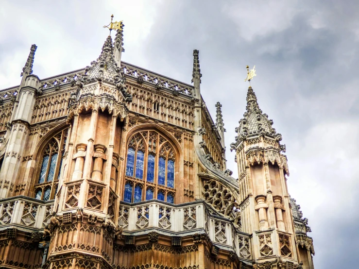 a very tall building with a clock on it's side, inspired by William Mustart Lockhart, pexels contest winner, renaissance, archways between stalagtites, underwater westminster, brown, flying buttresses