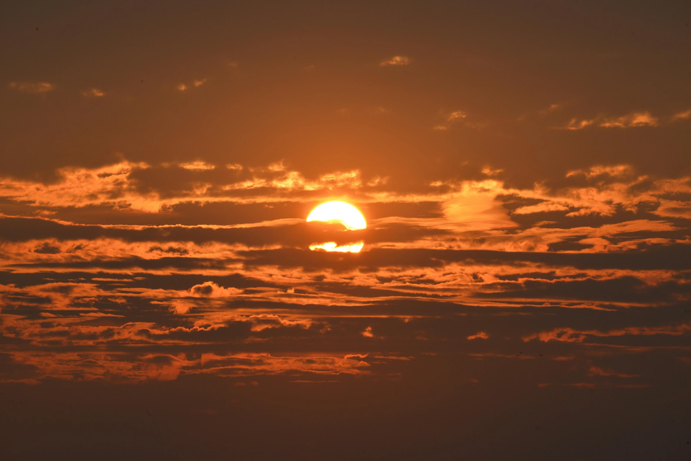 the sun is setting behind the clouds in the sky, pexels contest winner, romanticism, digital yellow red sun, wide, fire from sky, over the horizon