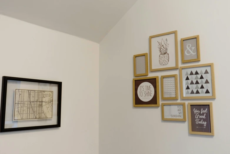 a bathroom with a toilet and pictures on the wall, inspired by Jan Müller, unsplash, visual art, gold and silver shapes, square pictureframes, 3/4 view from below, mappa studio