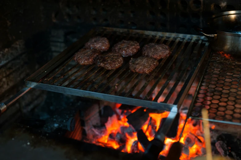 hamburgers cooking on a grill over an open fire, by Joe Bowler, pexels, pbr, panels, islamic, sunken