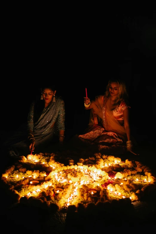 a group of people sitting around a fire, by Alice Mason, pexels, land art, standing in a hindu kovil, leds, halloween, profile image