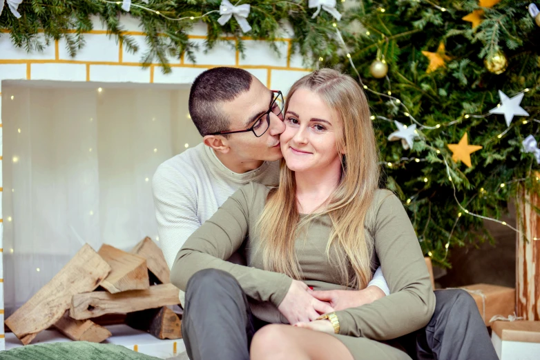 a man and woman sitting in front of a christmas tree, a picture, pexels contest winner, romanticism, girl wearing round glasses, marton gyula kiss ( kimagu ), portait photo profile picture, profile picture 1024px