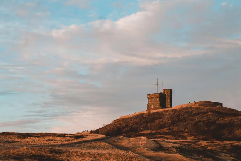 a tall tower sitting on top of a hill, by Jesper Knudsen, pexels contest winner, late summer evening, marsden, military outpost, thumbnail