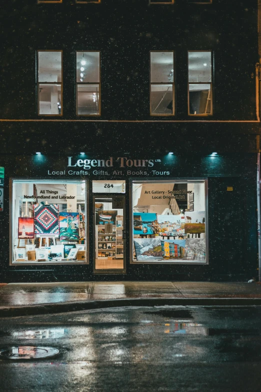 a store front on a wet street at night, poster art, by LeConte Stewart, trending on unsplash, legends, museum display, in the middle of new york, touring