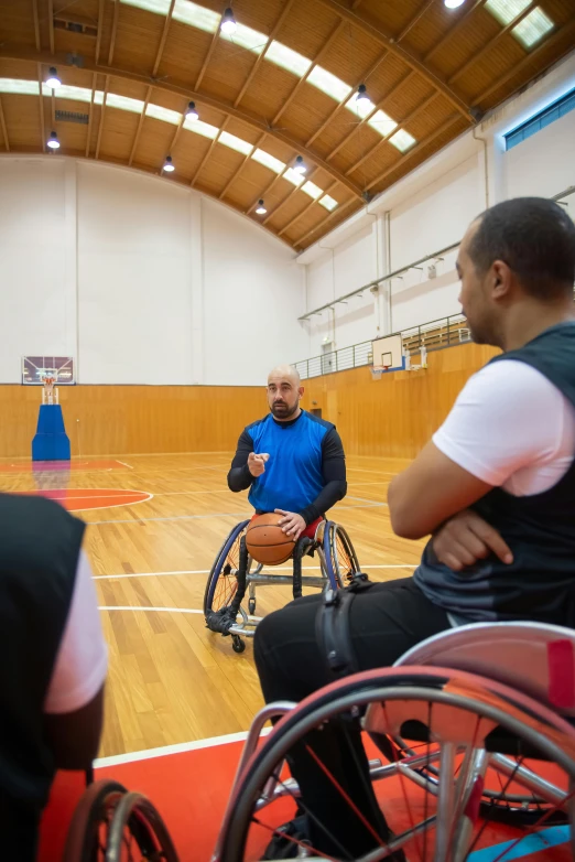 a group of men in wheelchairs playing a game of basketball, featured on dribble, elias chatzoudis, profile image, looking serious, ( ( theatrical ) )