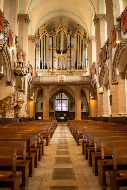 a church filled with lots of wooden pews, an album cover, inspired by Matthias Stom, pexels, utrecht, view from front, high arches, facing front