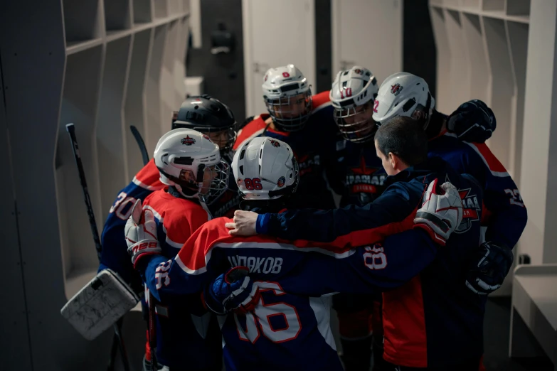 a group of hockey players huddled in a locker, a picture, by Adam Marczyński, pexels contest winner, hurufiyya, in an arena pit, silver, 2263539546], anna nikonova