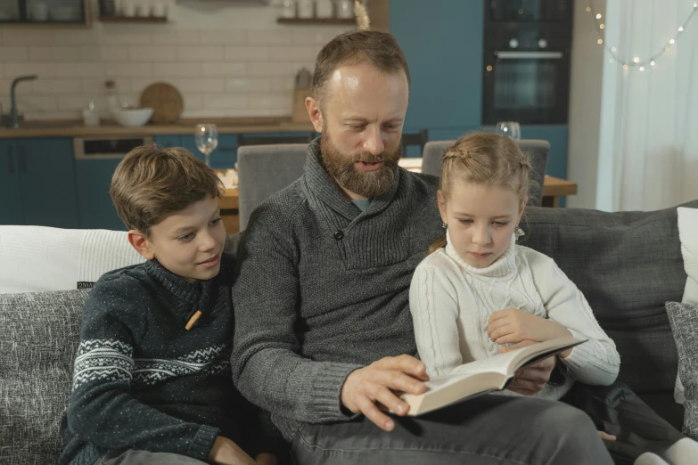 a man and two children sitting on a couch reading a book, pexels contest winner, avatar image, maintenance photo, 268435456k film, high quality screenshot