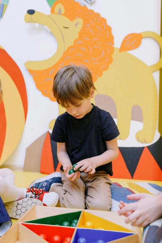 a group of children sitting on the floor playing with blocks, pexels contest winner, interactive art, jungle around him, in the zoo exhibit, 🦑 design, profile image