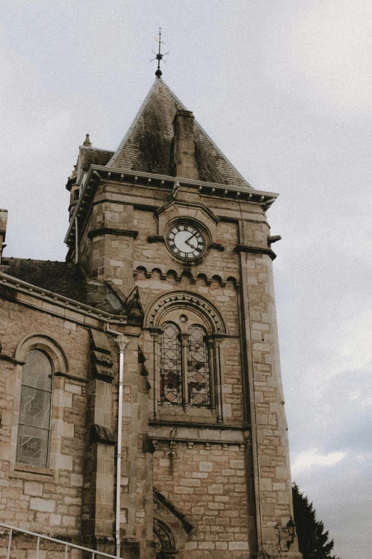 a building with a clock on the front of it, an album cover, by IAN SPRIGGS, unsplash, romanesque, paisley, grey skies, up there, churches